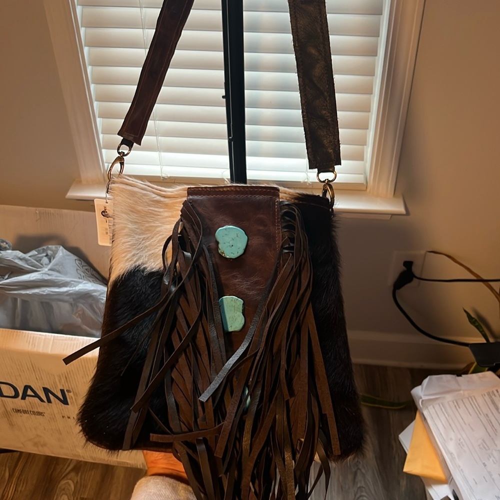 Real leather cowhide crossbody with turquoise slabs. Never worn.